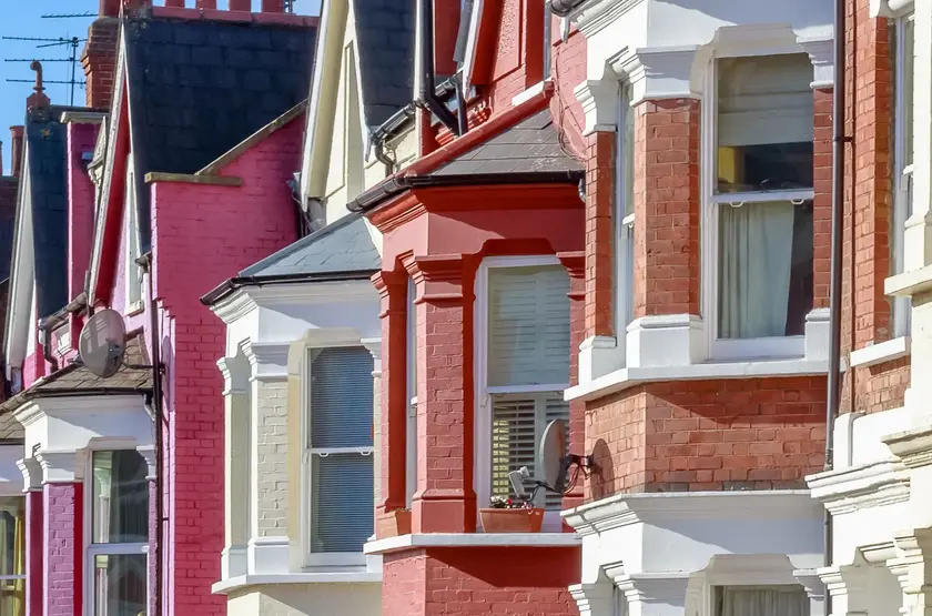 a row of houses with red and white brick