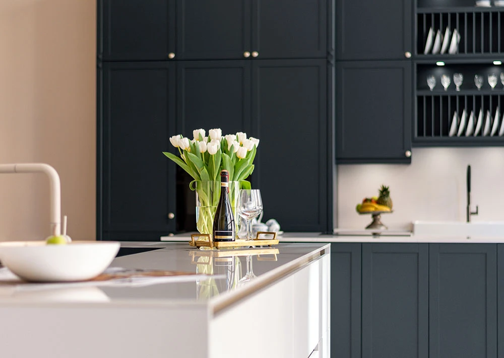 a white flowers in a vase on a counter