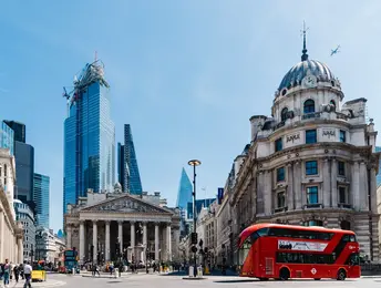 a red bus in a city