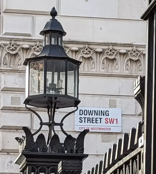 a street lamp on a fence
