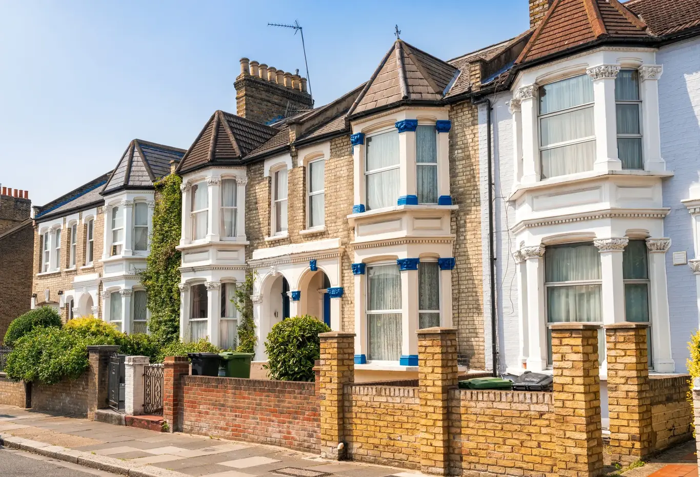 a row of houses with brick walls