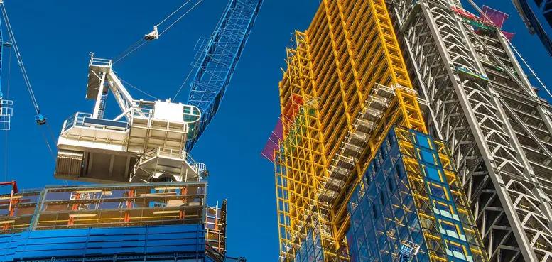 a crane and a tall building under construction