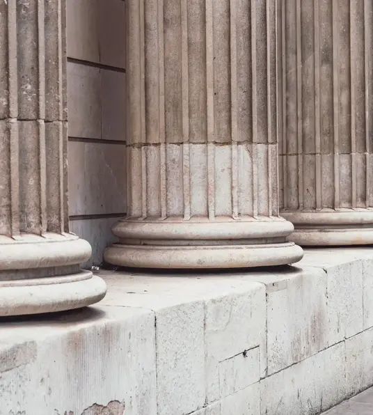 a row of pillars on a wall