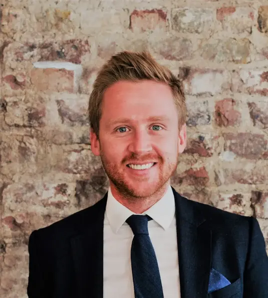 a man in a suit and tie