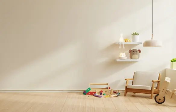 a room with a white wall and shelves with toys