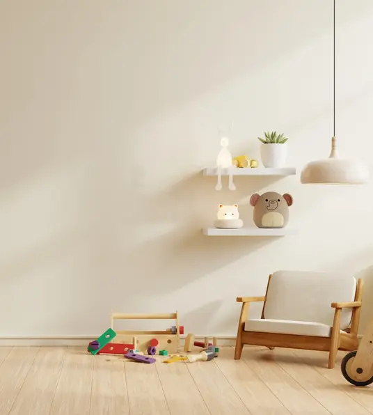 a room with a white wall and shelves with toys