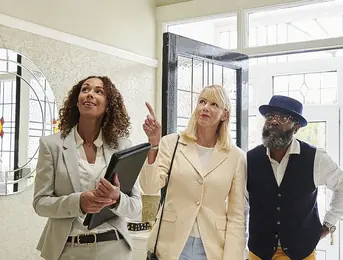 a group of people standing in a room