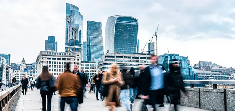 a group of people walking in a city