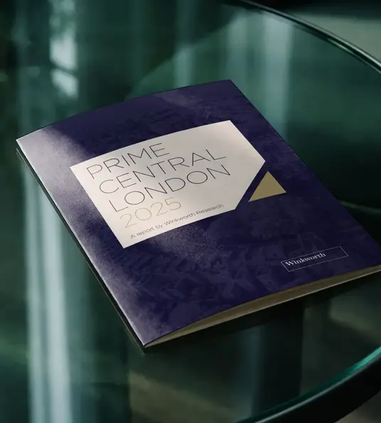 a blue book on a glass table