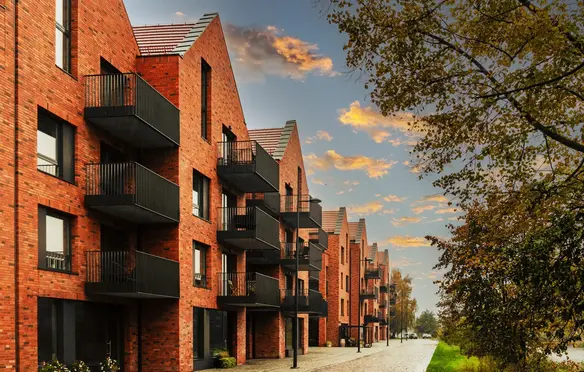a row of brick buildings with balconies