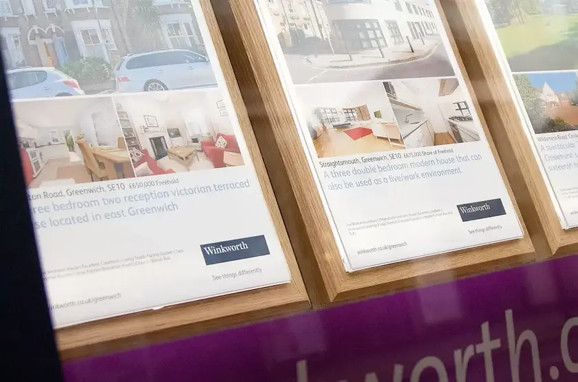 a group of posters on a wall