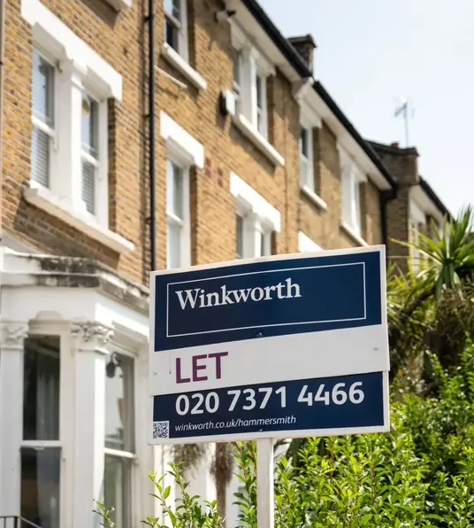 a sign in front of a building