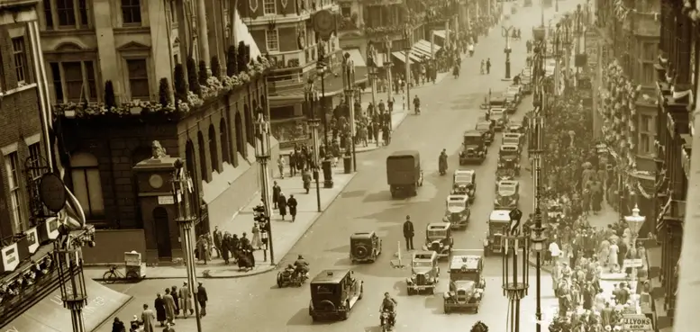 a street with cars and people on it