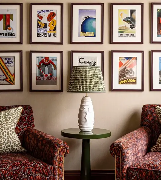 a room with chairs and a lamp