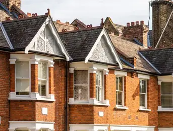 a brick building with a chimney