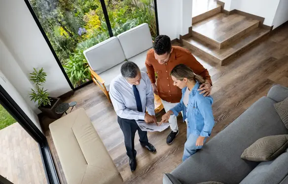 a group of people looking at a piece of paper