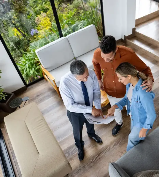 a group of people looking at a piece of paper