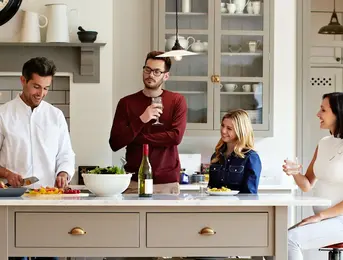 a group of people in a kitchen