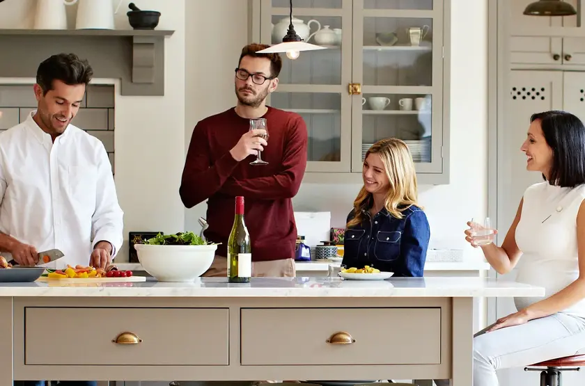 a group of people in a kitchen