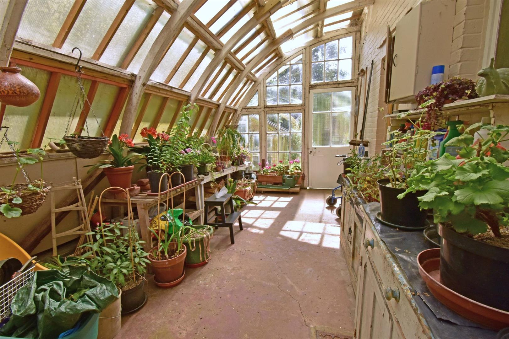 A LEANTO GREENHOUSE.