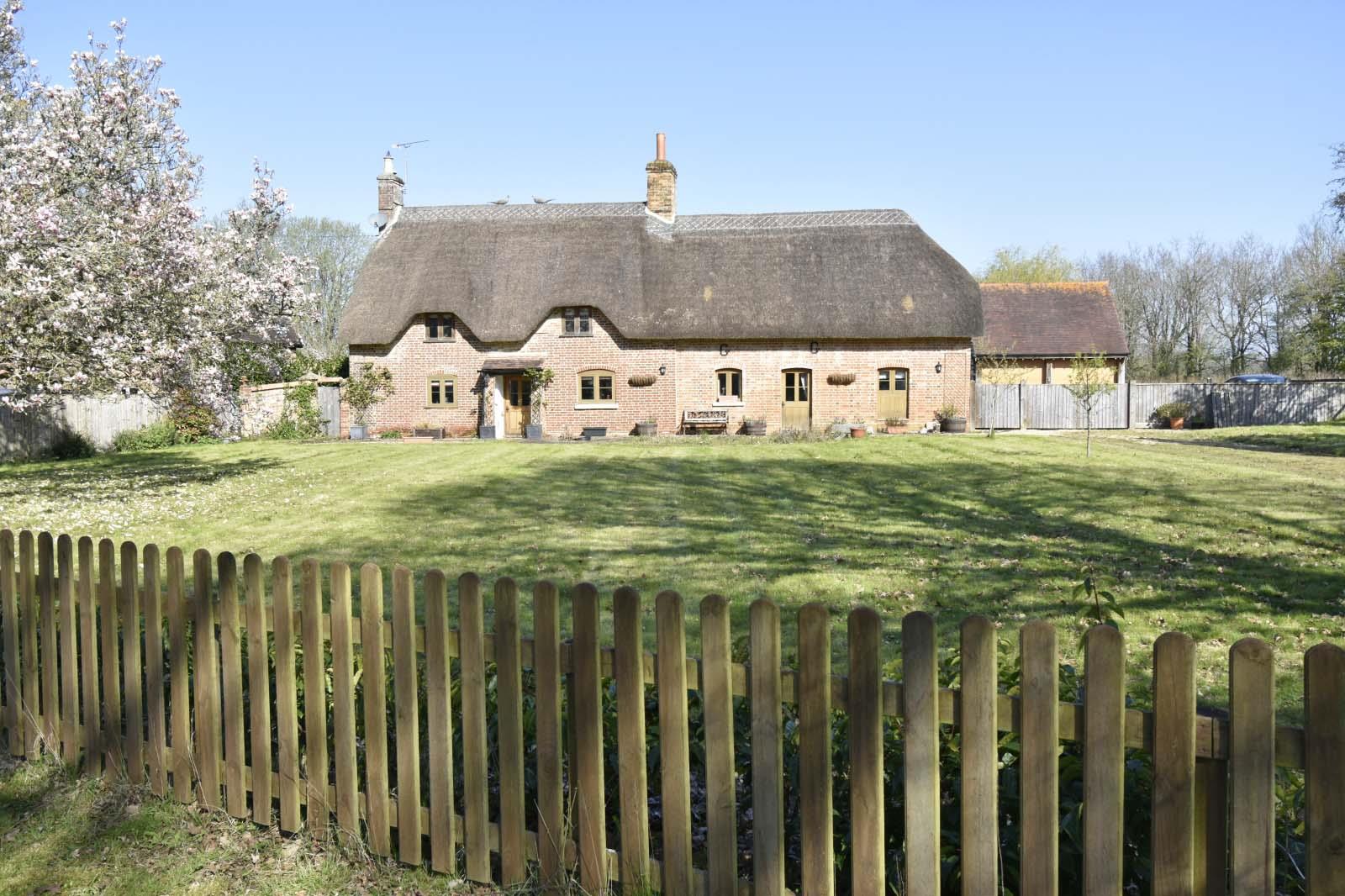 A FRONT WITH FENCE.J